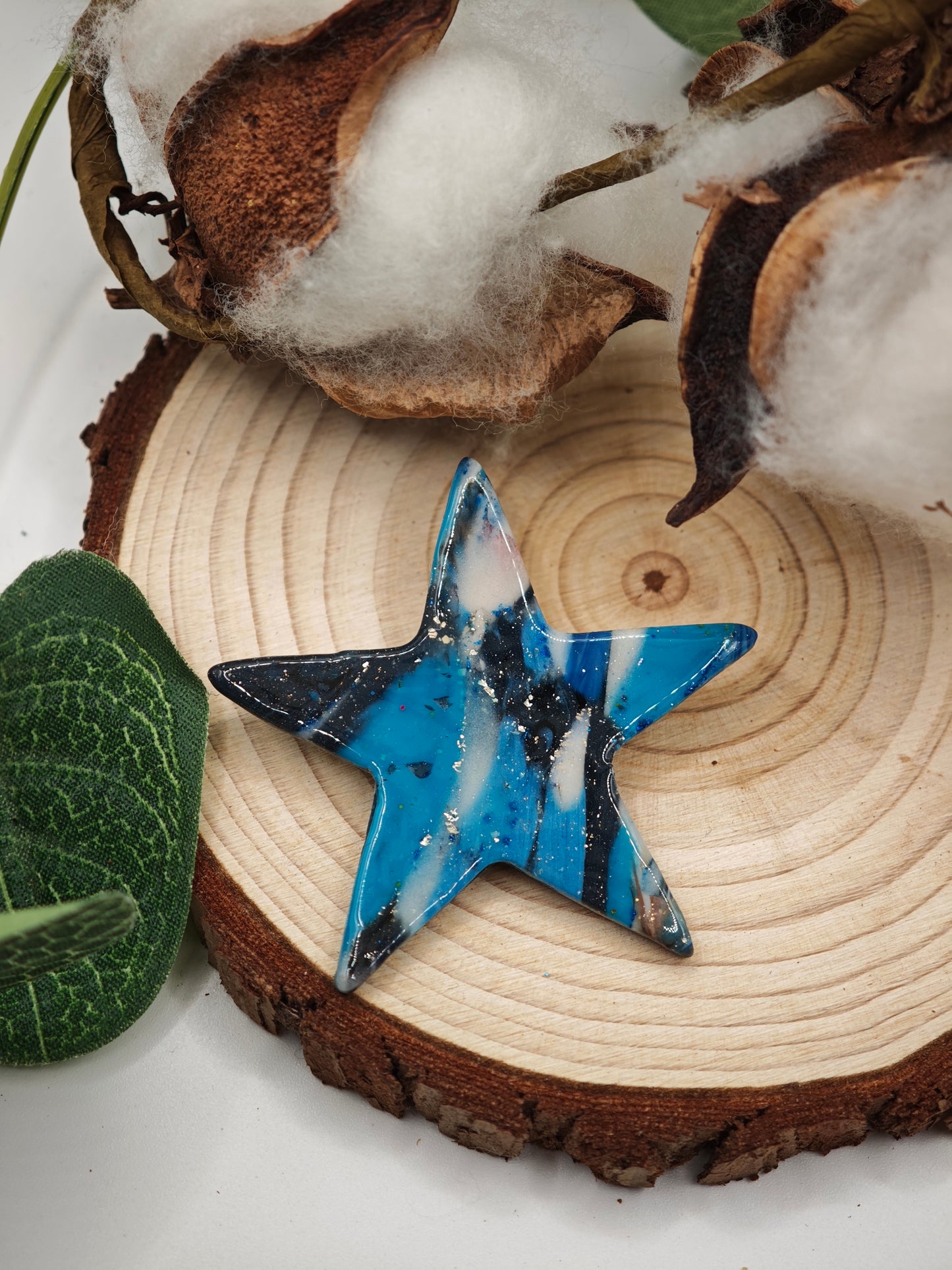 Blue star brooch